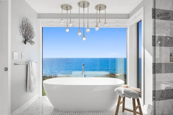 Distinguished Oceanfront Point Estate with Iconic Beach + Mountain Vistas