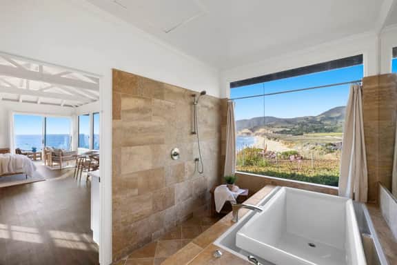 Distinguished Oceanfront Point Estate with Iconic Beach + Mountain Vistas